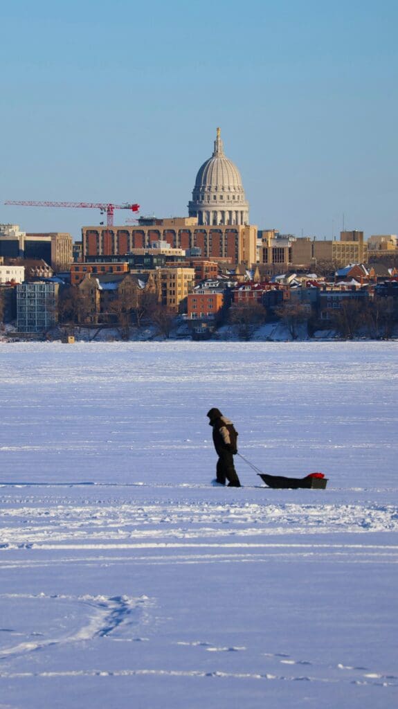 What Madison is really like in the winter. Madison winters are real. The average low in January is around 11°F. Dane County receives approximately 50 inches of snow per year. The lakes freeze solidly enough to drive trucks on in deep winter.
